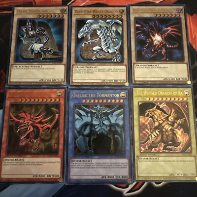 Dark magician, Blue Eyes, Red Eyes, Slifer, Obelisk, Ra yugioh + Random Booster!-image